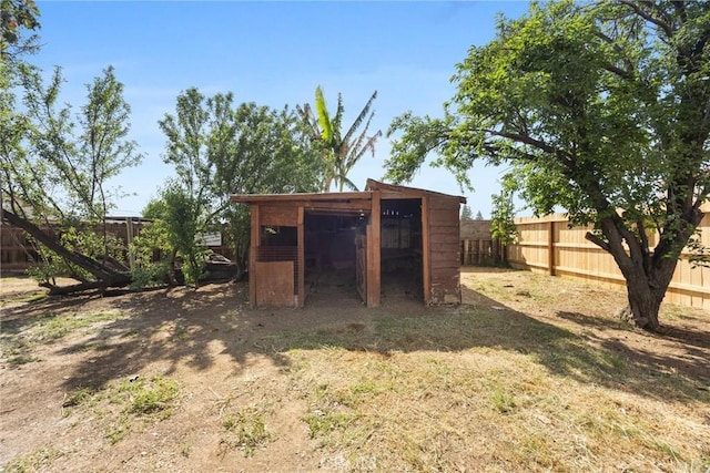 view of poultry coop featuring a fenced backyard