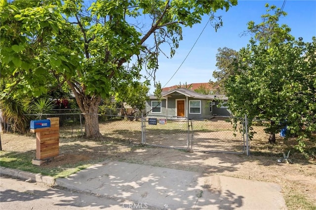 bungalow-style house with a gate and a fenced front yard