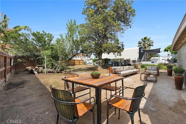 view of patio with an outdoor living space and a fenced backyard