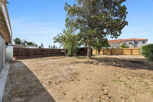 view of yard with a fenced backyard