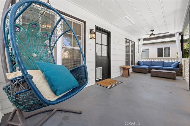 view of patio featuring an outdoor living space and ceiling fan