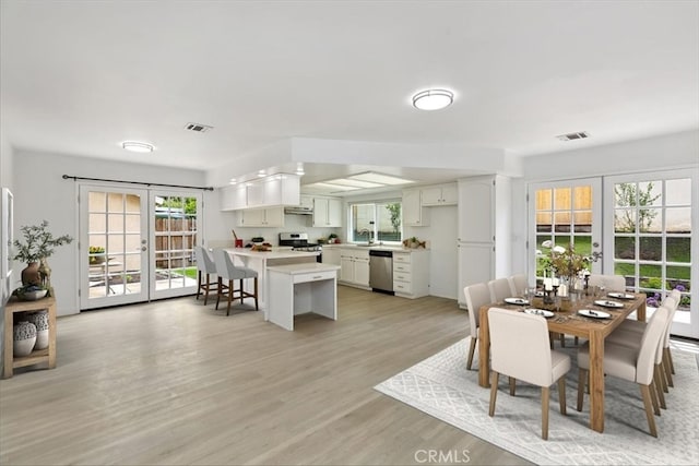 810 Hacienda Dr, Riverside, CA 92507 - dining area with visible vents, french doors, and light wood-style flooring