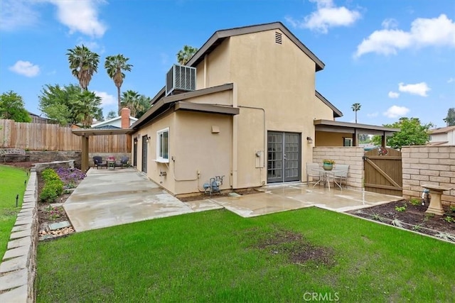 810 Hacienda Dr, Riverside, CA 92507 - rear view of house with fence, a patio area, and a lawn