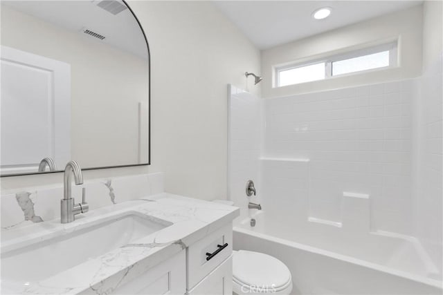 bathroom featuring toilet, shower / bathtub combination, visible vents, and vanity