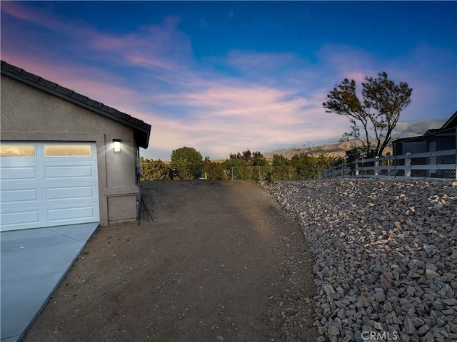 view of road with driveway
