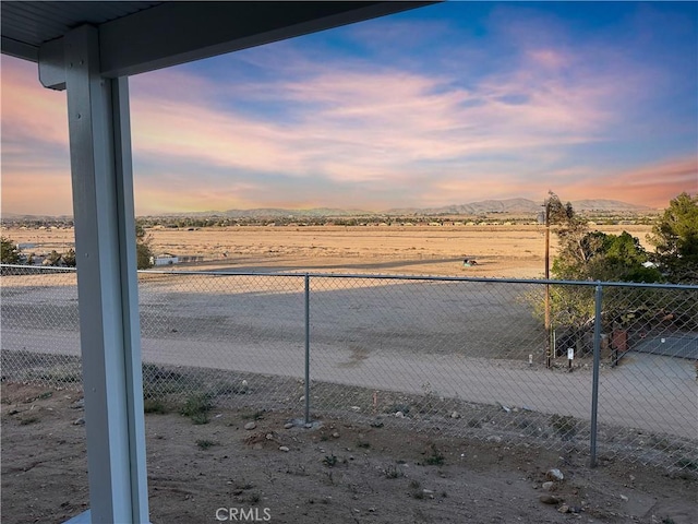 view of water feature featuring fence and a mountain view