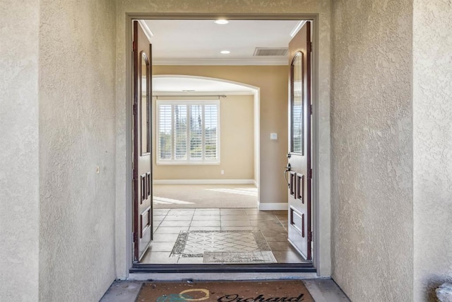 entrance to property featuring visible vents