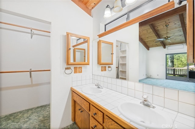 bathroom with beam ceiling, wooden ceiling, tasteful backsplash, and a sink