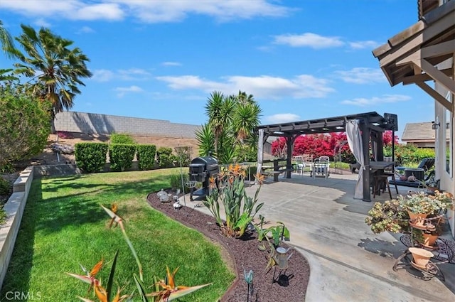view of yard with a pergola and a patio
