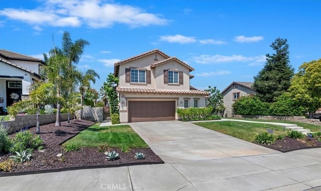 mediterranean / spanish house featuring a front lawn, a garage, stucco siding, concrete driveway, and a tiled roof