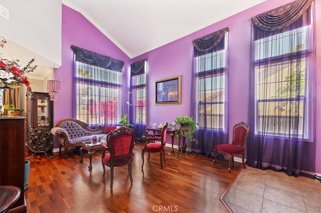 sitting room featuring high vaulted ceiling, visible vents, ornamental molding, and wood finished floors