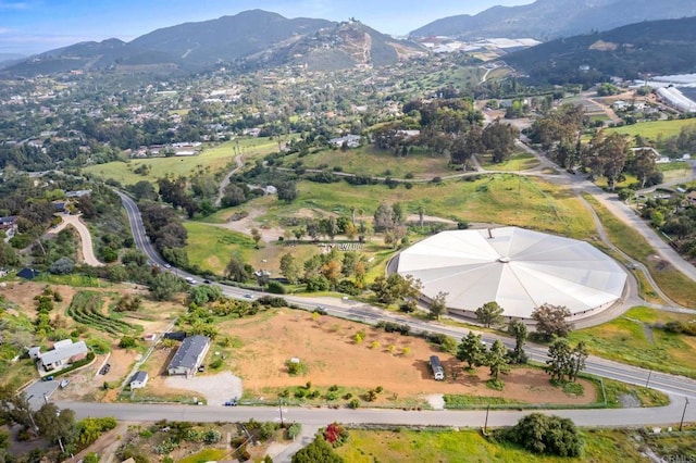 birds eye view of property featuring a mountain view