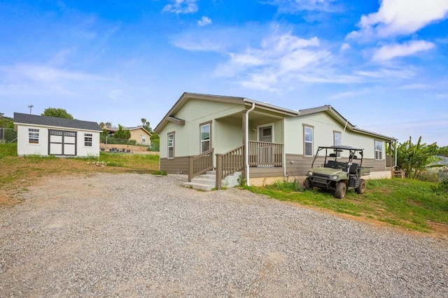 manufactured / mobile home with a storage unit and an outdoor structure