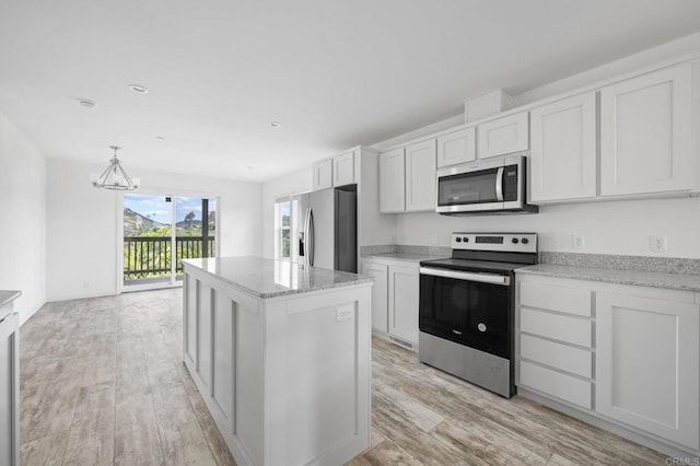 3755 Buena Creek Rd, Vista, CA 92084 - kitchen with light wood-type flooring, a center island, white cabinetry, a chandelier, and stainless steel appliances
