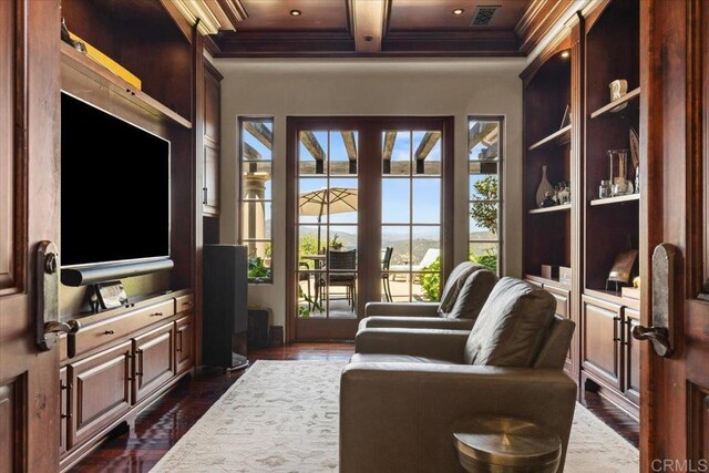 interior space featuring visible vents, ornamental molding, beamed ceiling, dark wood-type flooring, and coffered ceiling