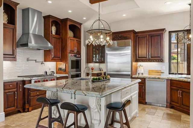 kitchen with recessed lighting, a chandelier, wall chimney range hood, and stainless steel appliances