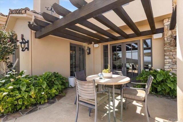 view of patio featuring french doors and outdoor dining space