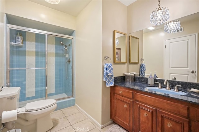 full bath featuring vanity, toilet, tile patterned floors, baseboards, and a shower stall