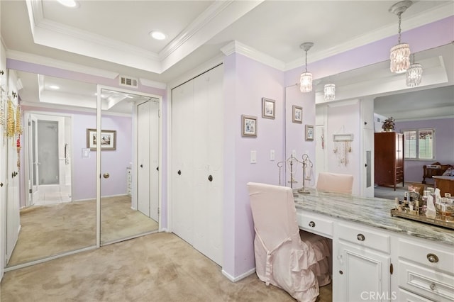 bathroom featuring a raised ceiling, recessed lighting, baseboards, visible vents, and ornamental molding