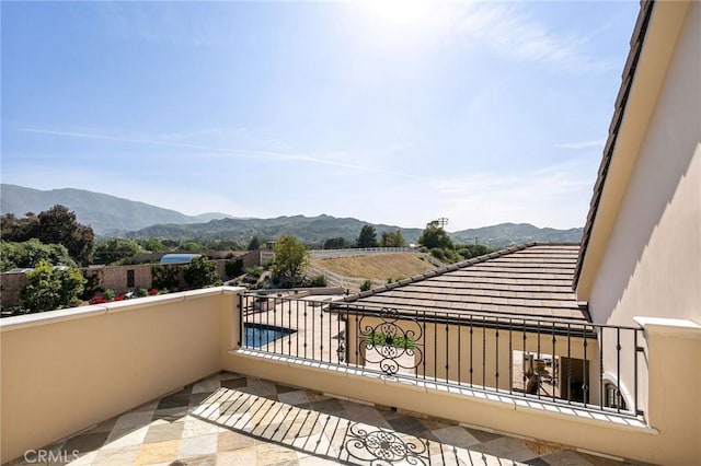 balcony featuring a mountain view