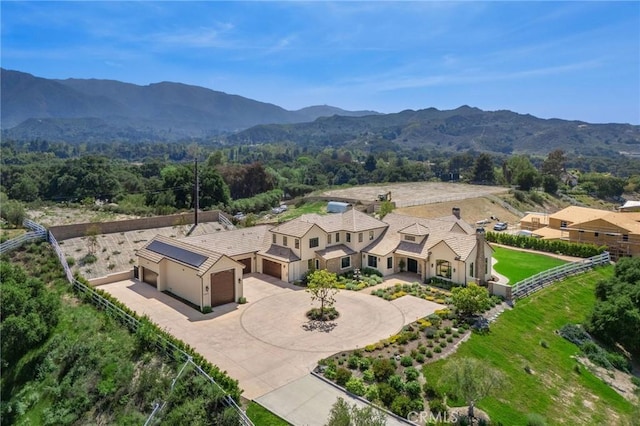 birds eye view of property with a mountain view