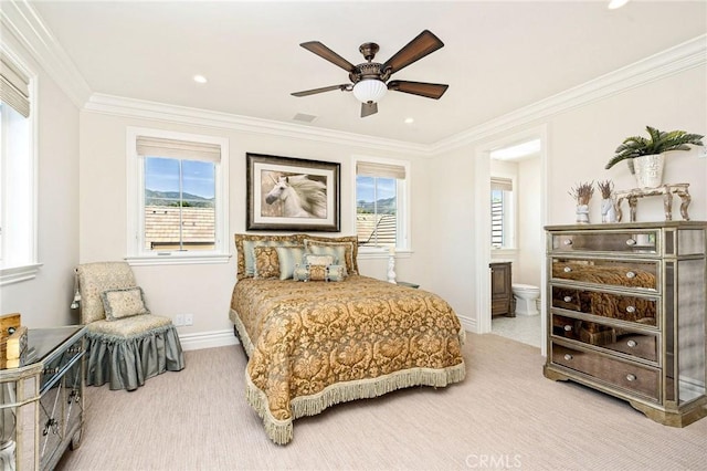 bedroom featuring visible vents, ornamental molding, multiple windows, and carpet