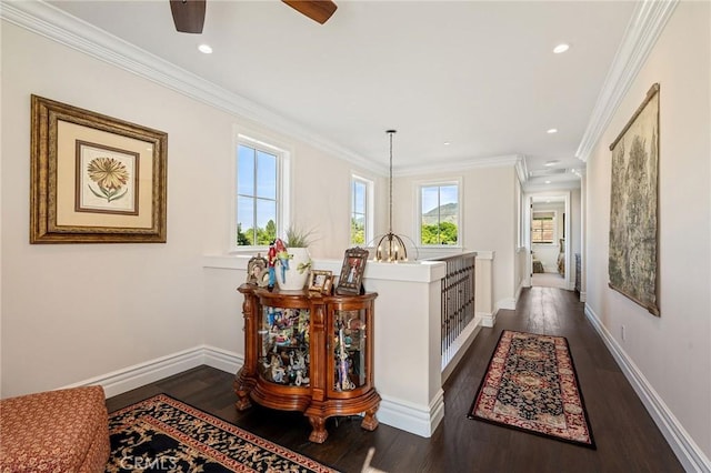 hallway featuring recessed lighting, ornamental molding, dark wood finished floors, and baseboards