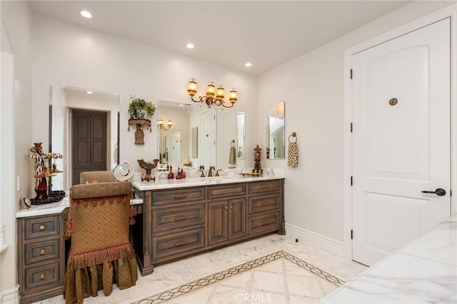 bathroom with recessed lighting, an inviting chandelier, marble finish floor, vanity, and baseboards
