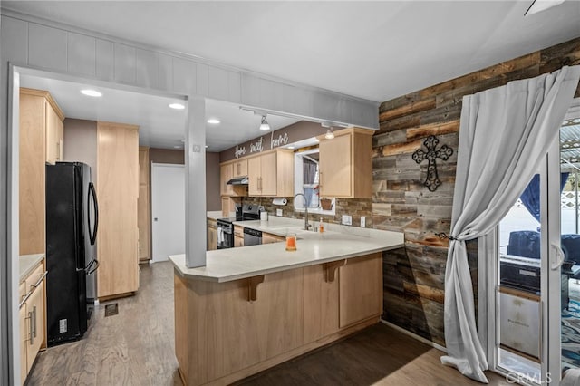 3520 Rosewood Pl, Riverside, CA 92506 - kitchen with a sink, light brown cabinetry, a healthy amount of sunlight, and stainless steel appliances