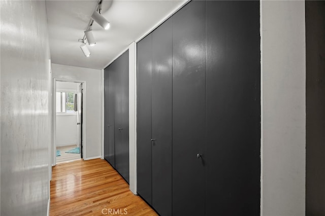 3520 Rosewood Pl, Riverside, CA 92506 - hallway featuring track lighting and light wood finished floors