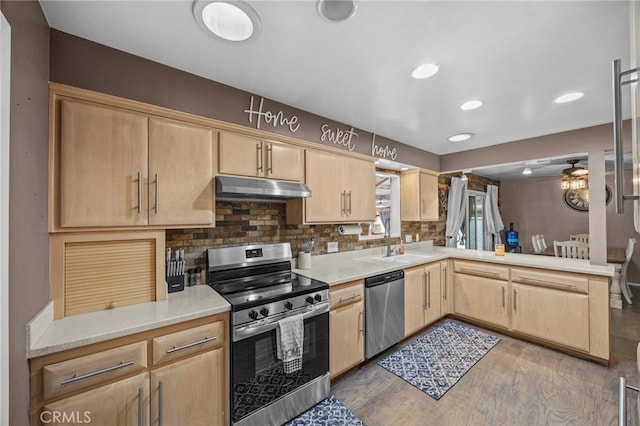 3520 Rosewood Pl, Riverside, CA 92506 - kitchen featuring light brown cabinetry, under cabinet range hood, appliances with stainless steel finishes, and a peninsula