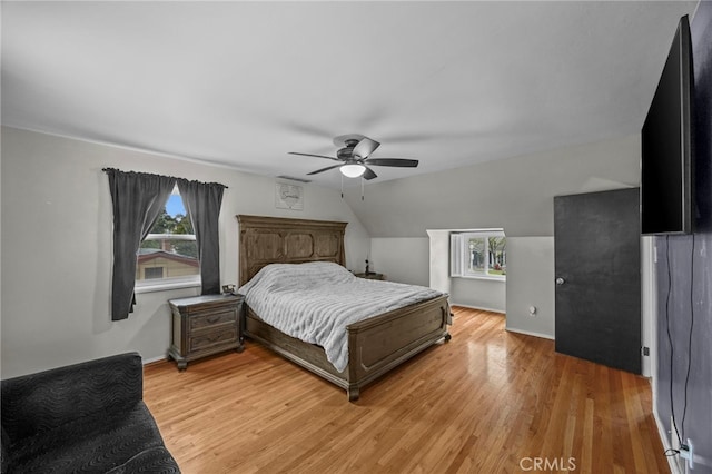 3520 Rosewood Pl, Riverside, CA 92506 - bedroom with light wood-style floors, a ceiling fan, vaulted ceiling, and multiple windows
