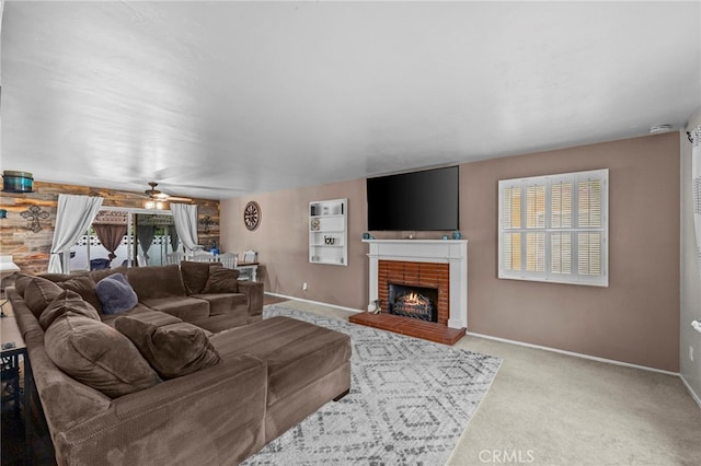 3520 Rosewood Pl, Riverside, CA 92506 - living room featuring carpet floors, baseboards, a brick fireplace, and ceiling fan