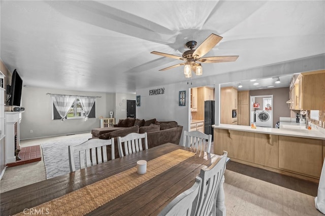 3520 Rosewood Pl, Riverside, CA 92506 - dining space with a ceiling fan, light wood-type flooring, and washer / clothes dryer