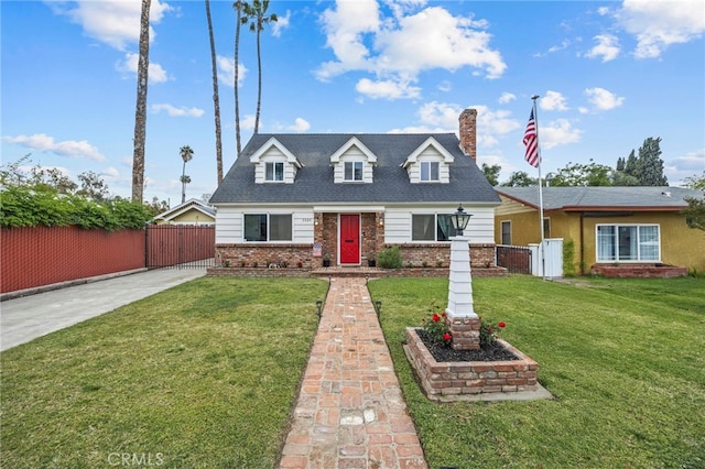 3520 Rosewood Pl, Riverside, CA 92506 - cape cod-style house featuring fence, a front yard, a chimney, brick siding, and a gate