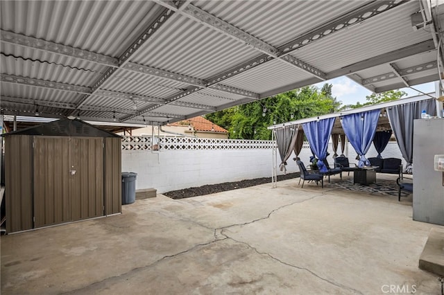 3520 Rosewood Pl, Riverside, CA 92506 - view of patio featuring an outbuilding, a fenced backyard, and a shed