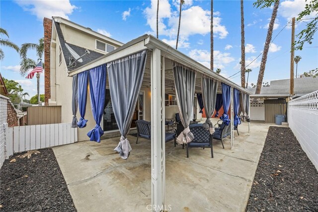 3520 Rosewood Pl, Riverside, CA 92506 - rear view of property with fence, an outdoor hangout area, and a patio area