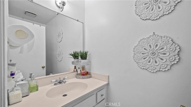 bathroom featuring visible vents and vanity