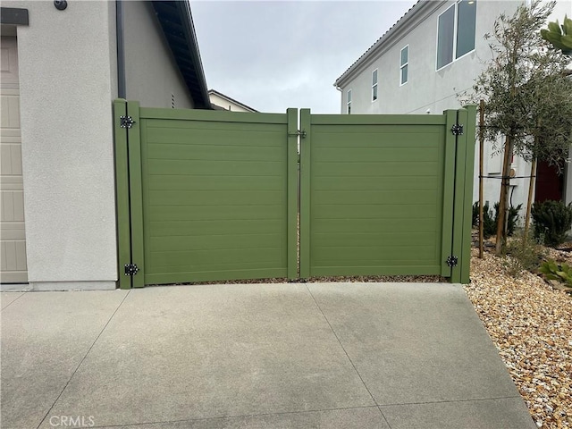 view of gate with fence