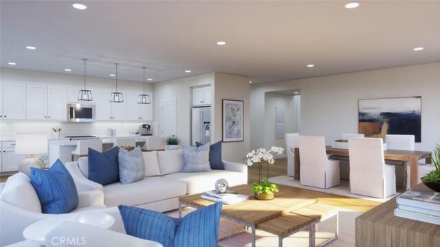 living room with recessed lighting and light wood finished floors