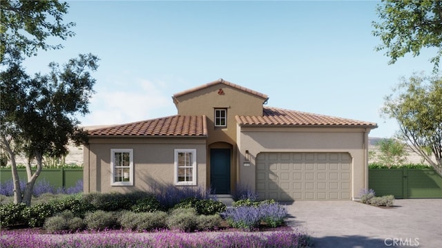 mediterranean / spanish-style house with a tile roof, an attached garage, driveway, stucco siding, and fence