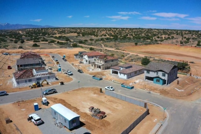 aerial view with view of desert, a mountain view, and a rural view