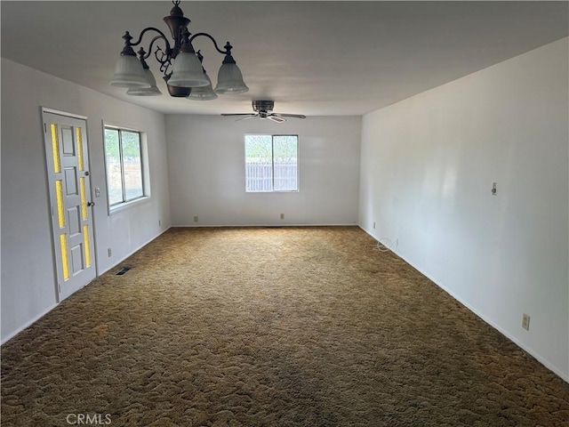 14685 17th Ave, Lemoore, CA 93245 - carpeted spare room featuring a wealth of natural light and ceiling fan with notable chandelier