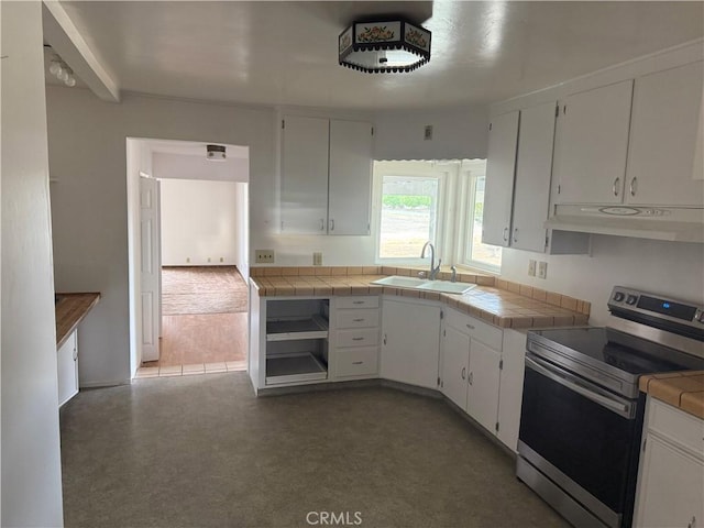 14685 17th Ave, Lemoore, CA 93245 - kitchen with tile counters, under cabinet range hood, white cabinets, a sink, and stainless steel range with electric cooktop