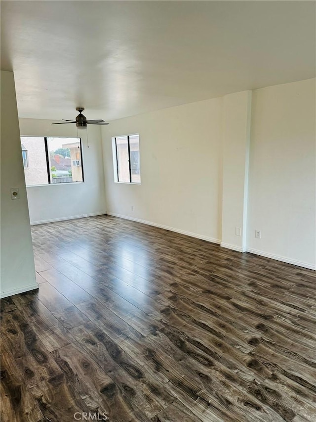 850W 157th Unit 6, Gardena, CA 90247 - spare room with baseboards, ceiling fan, and dark wood-style flooring