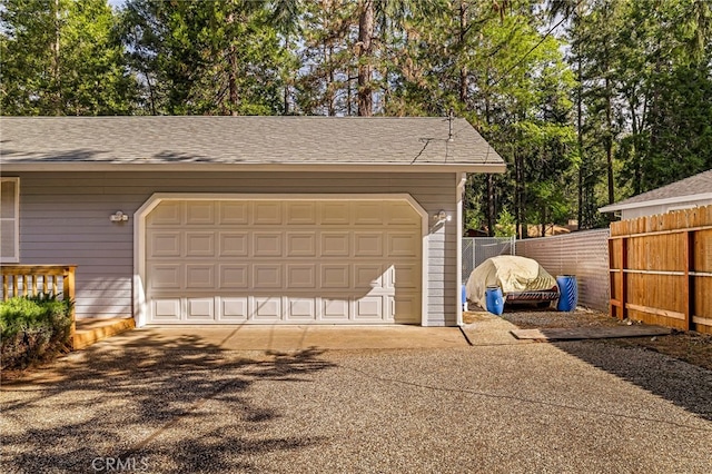 garage with fence