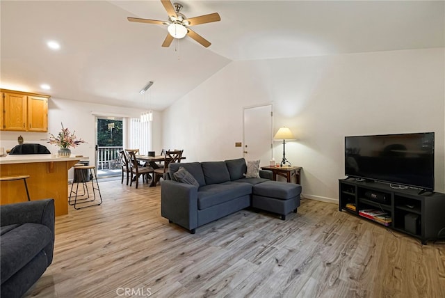 living room featuring recessed lighting, vaulted ceiling, light wood finished floors, baseboards, and a ceiling fan