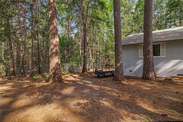 view of yard featuring a view of trees