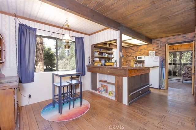 bar with a wealth of natural light, hardwood / wood-style floors, beamed ceiling, and wooden ceiling