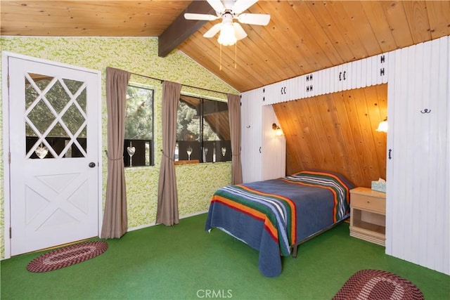 carpeted bedroom with wooden walls, wooden ceiling, ceiling fan, and vaulted ceiling with beams